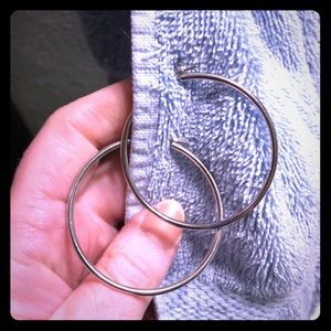 Sturdy metal hoop earrings, silver alloy.